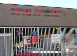 Principal LoPresto stands in front of the school office